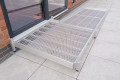 Modular wheelchair ramp with turning platform for wheelchair access 