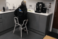 lifestyle image of person on chair in kitchen