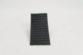 Rubber wheel chock with anti-slip surface
