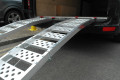 Motorcycle loading ramps on vehicle