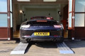 Sports car loading in to show room