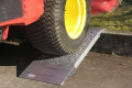 Aluminium container ramps resting on kerb 