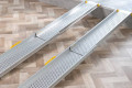 Extending ramps resting on step