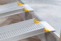 Telescopic ramps resting on step