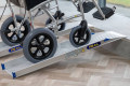 Wheelchair going up wheelchair ramps