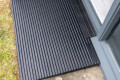 Rubber threshold ramp used with door sill guard on uPvc doorway outside