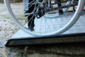 Wheelchair on fixed threshold ramp 
