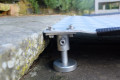 Adjustable leg on threshold ramp 