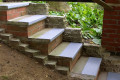 Grey anti-slip stair treads on concrete staircase