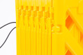 Expandable barrier with locking strap 