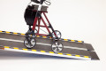 Rollator going up folding wheelchair ramp