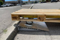 Pallet truck going up pallet truck ramp 
