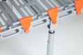Close up showing fixing point of support legs on rollable ramp 