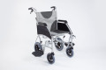 Transit wheelchair with legs rests moved to side 