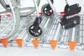 Manual wheelchair on the aluminium rollable ramp 