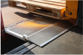 Pallet truck going over hinged tailboard