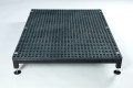 Large outdoor half step with black self-draining surface and adjustable feet