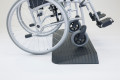 side view of rubber threshold ramp in use with manual wheelchair