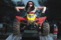 Buggy being ridden up a pair of motorcycle loading ramps