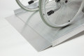 Wheelchair going up wheelchair ramp