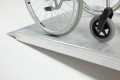 Wheelchair ramp grip surface