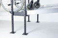 Joining support to connect two wheelchair ramps