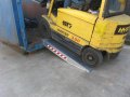 Forklift going up Pair of aluminium container ramps