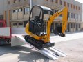 Aluminium loading ramps with mini digger 