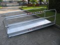 Vehicle ramp with handrails and anti slip surface 