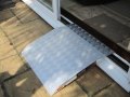 Aluminium wheelchair ramp on upvc doorway