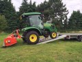 Tractor on loading ramps 