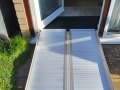 lower height rubber threshold ramp in combination with folding wheelchair ramp