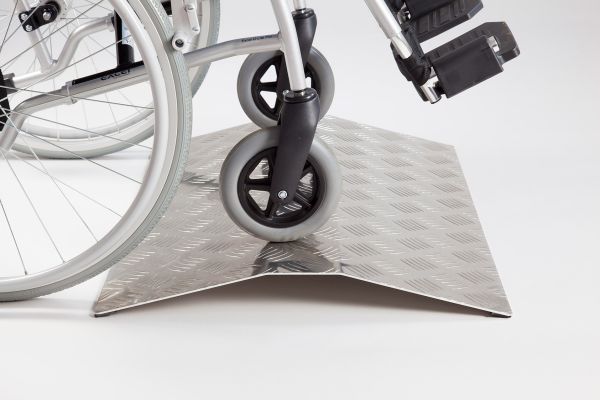 Wheelchair on aluminium ramp