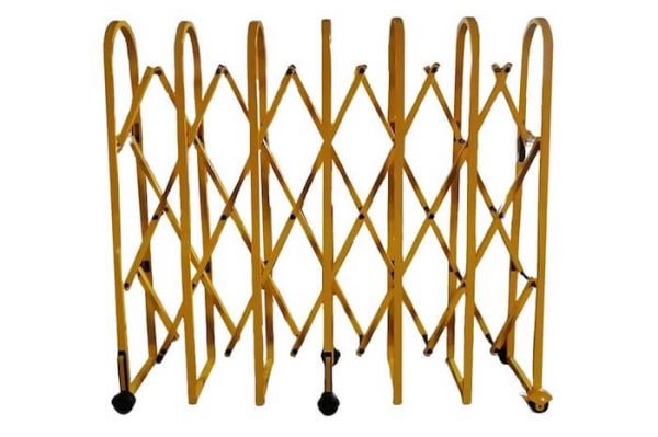 Yellow expandable gate barrier on wheels 