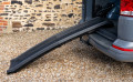 black folding pet ramp resting on the boot of a car