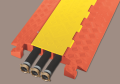Checkers Line Backer - 3 Channel Cable Protector Orange/Yellow with cables