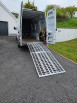extra wide loading ramps resting on van
