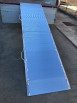 Viper folding heavy duty van ramp resting on vehicle