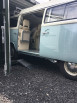 Camper van being loaded into a container using container ramps