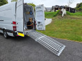 extra wide loading ramps resting on van