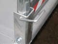 Handrail bracket on pedestrian walkway 