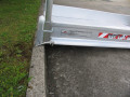 Pedestrian ramp resting on kerb 