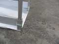 End of vehicle ramp with handrails 