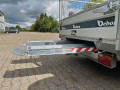 Aluminium loading ramps stored in trailer