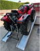 Tractor driving up alloy ramps 