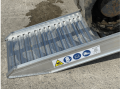 foot of the ramp on ground 