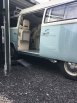Camper van being loaded into a container using container ramps