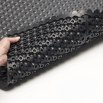 Textured grip on underside of anti-fatigue matting 