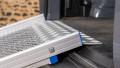 FEAL folding van ramp resting in place on the boot of a car - close up of the rest on connection