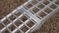 Close up of the hinge of the motorbike ramp